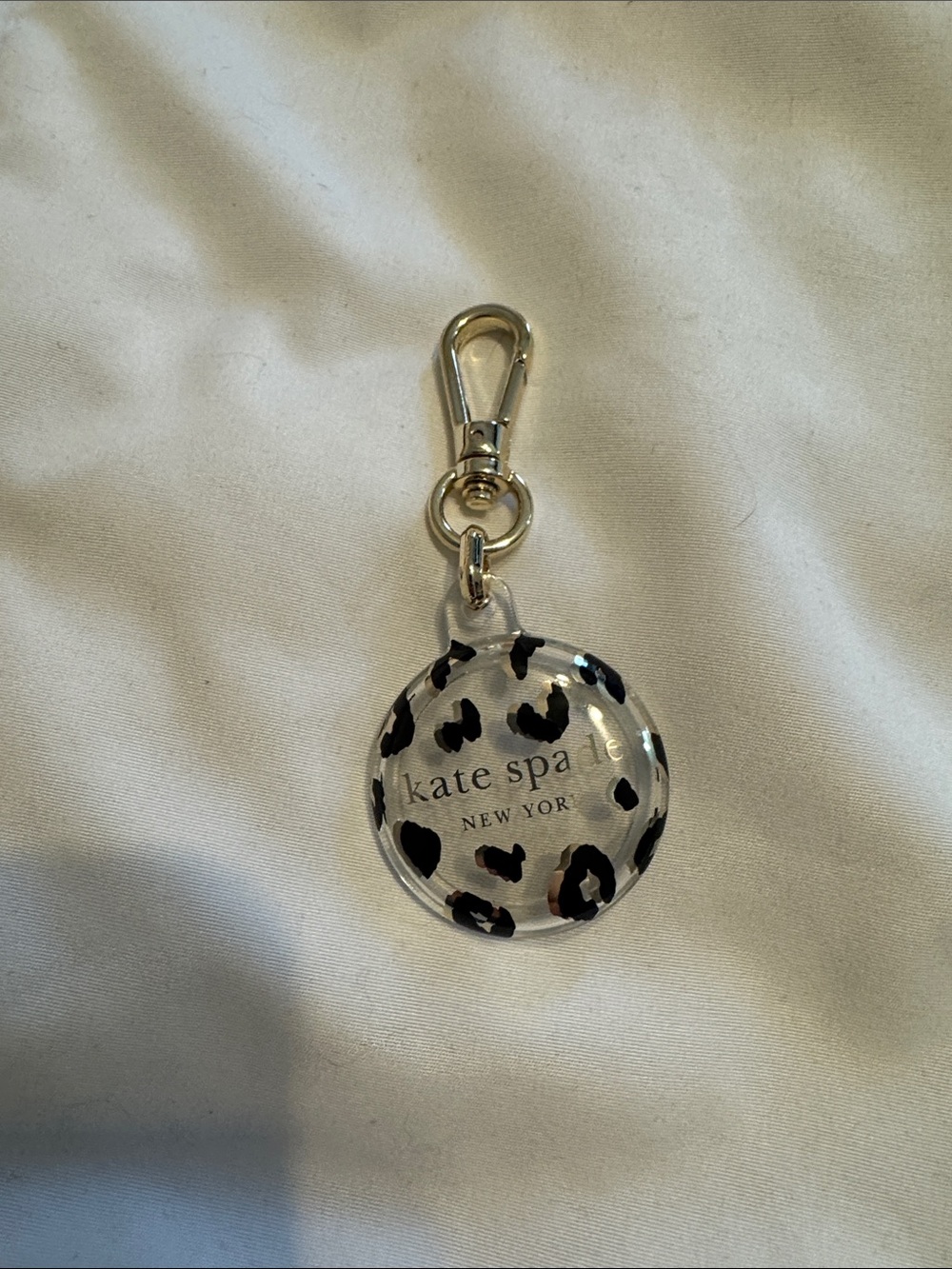 kate spade Leopard Print Clear Acrylic Apple AirTag clip with Gold Hardware